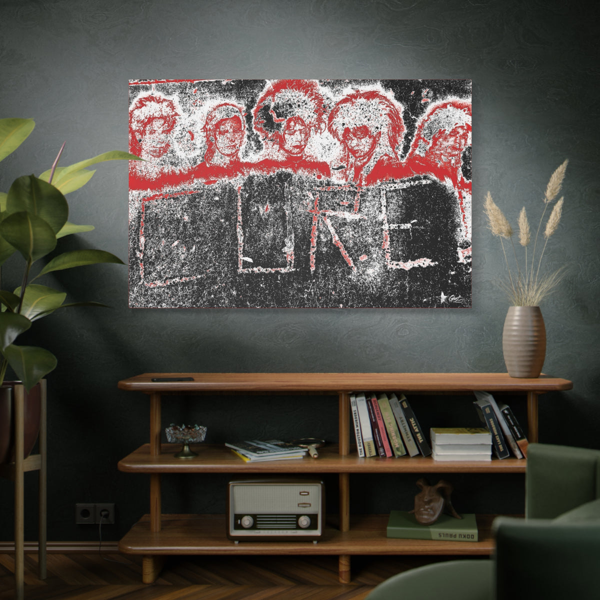Lowcountry Medicine oversized canvas above a wooden bookshelf, red-outlined faces over engraved lettering in a grungy sidewalk