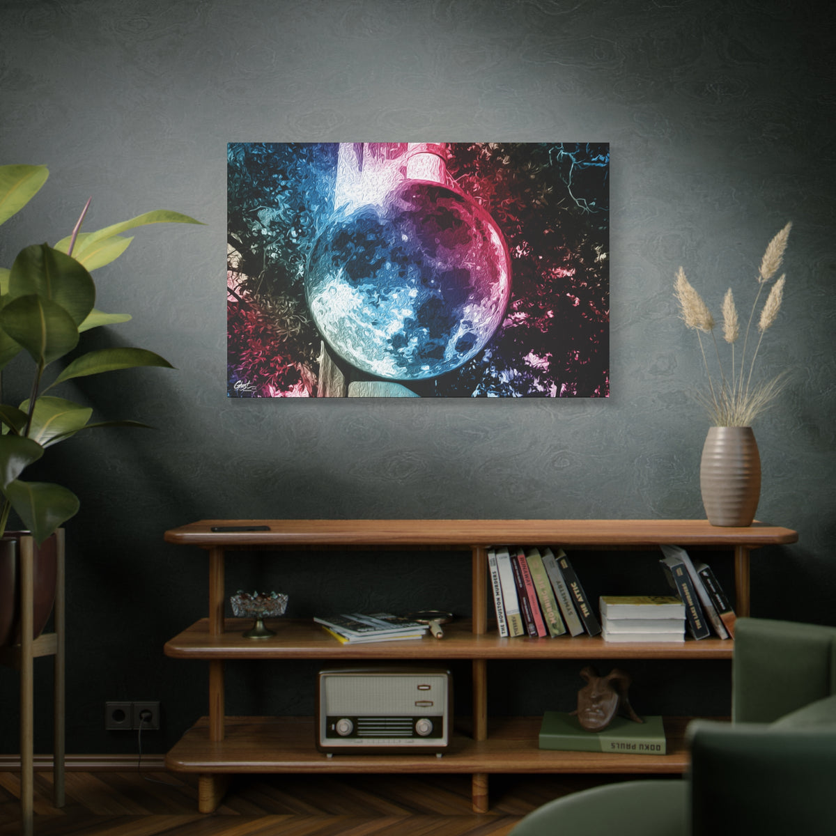 Universe in a Mirror large canvas above a wooden bookshelf, moon-like orb in blue and pink film tones in a surreal sky