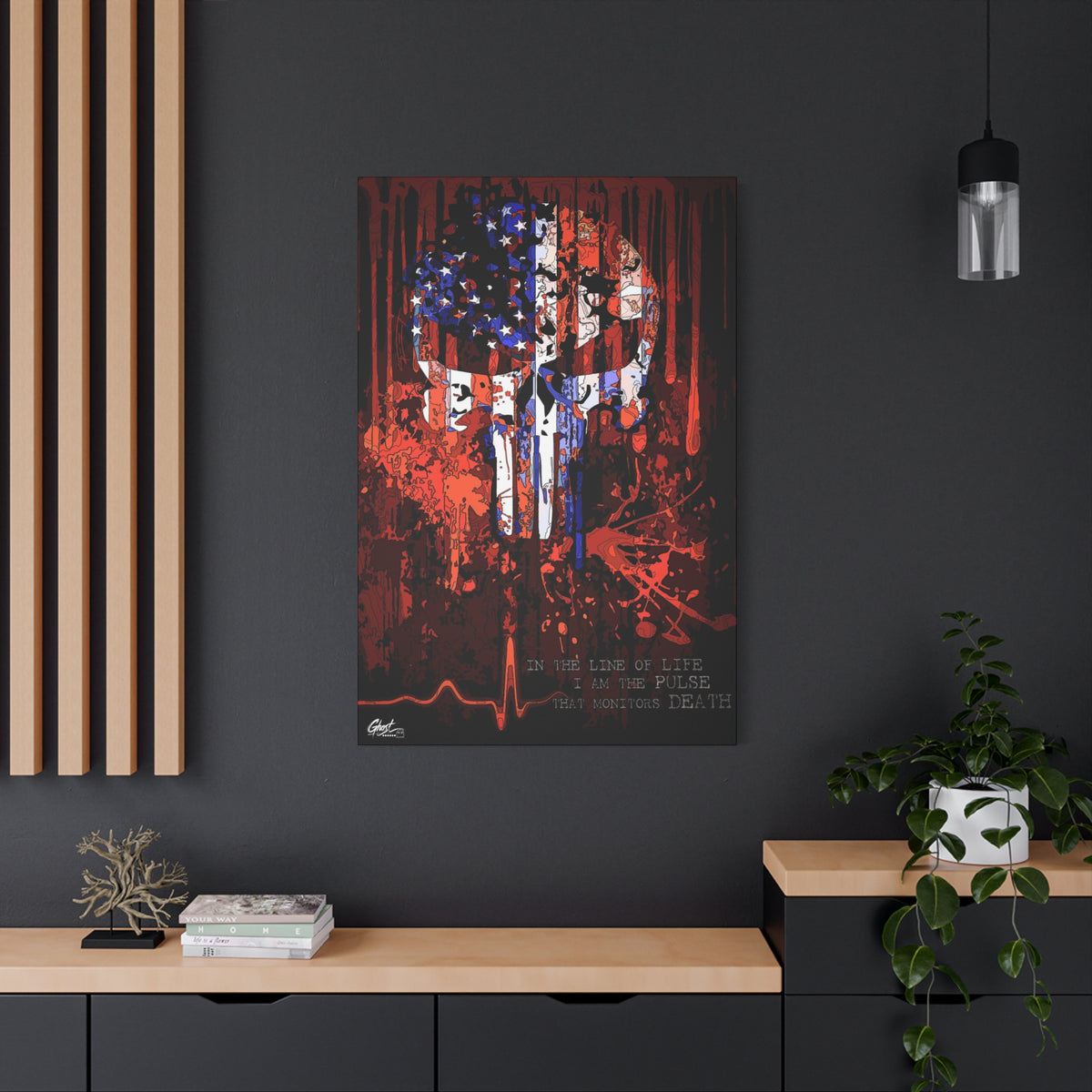 The Vigilante medium canvas on a charcoal wall by wood slats, skull emblem built from a distressed American flag
