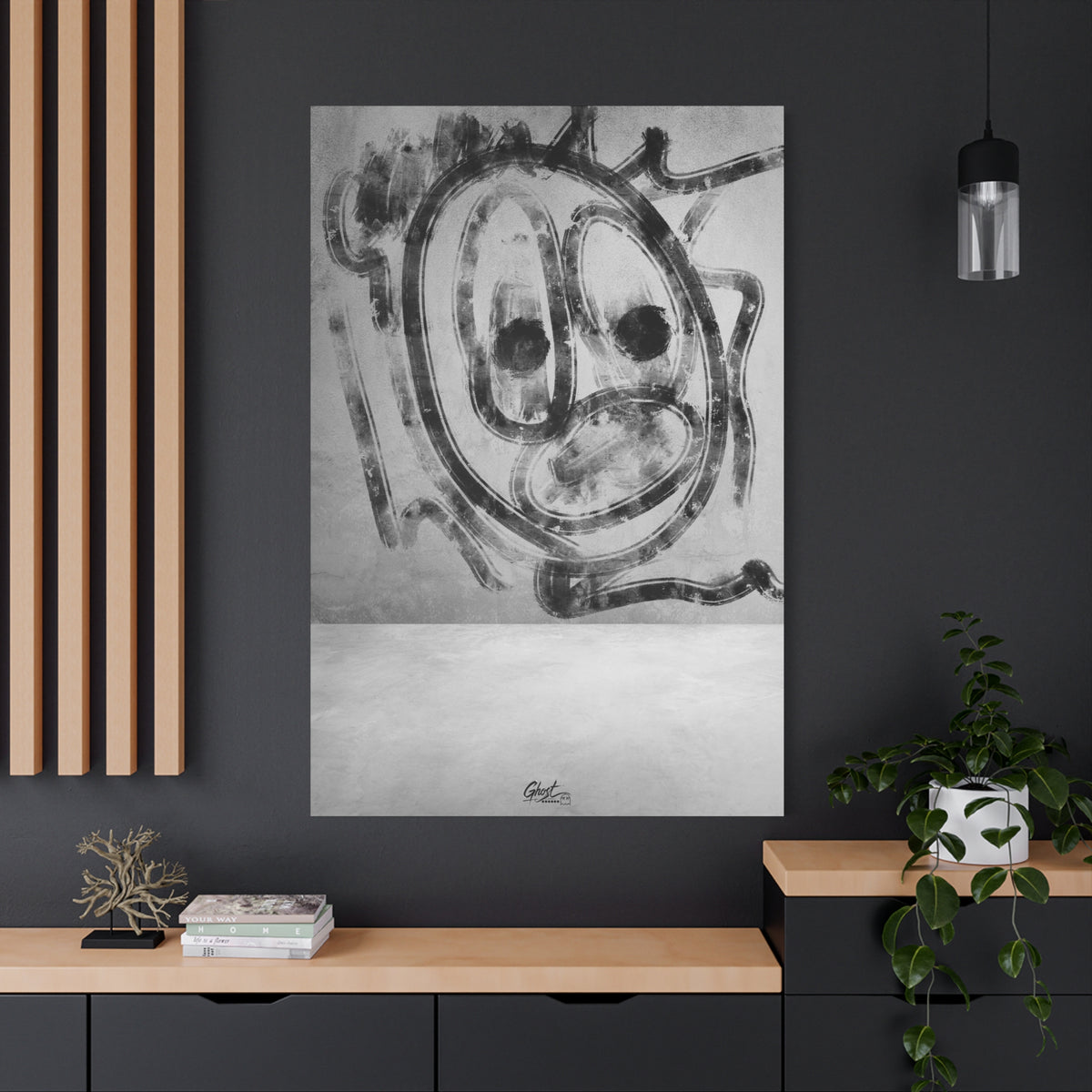 Thinking Out Loud oversized canvas on a charcoal wall over an oak shelf, black-and-white abstract face with blurred edges
