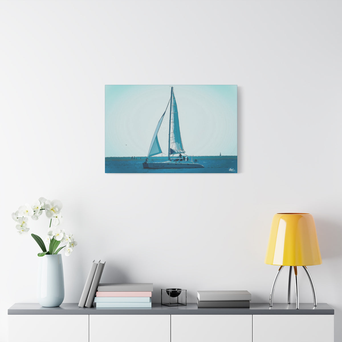 Freedom Sailing oversized canvas on a white wall above a console, painterly teal seascape with a single sailboat
