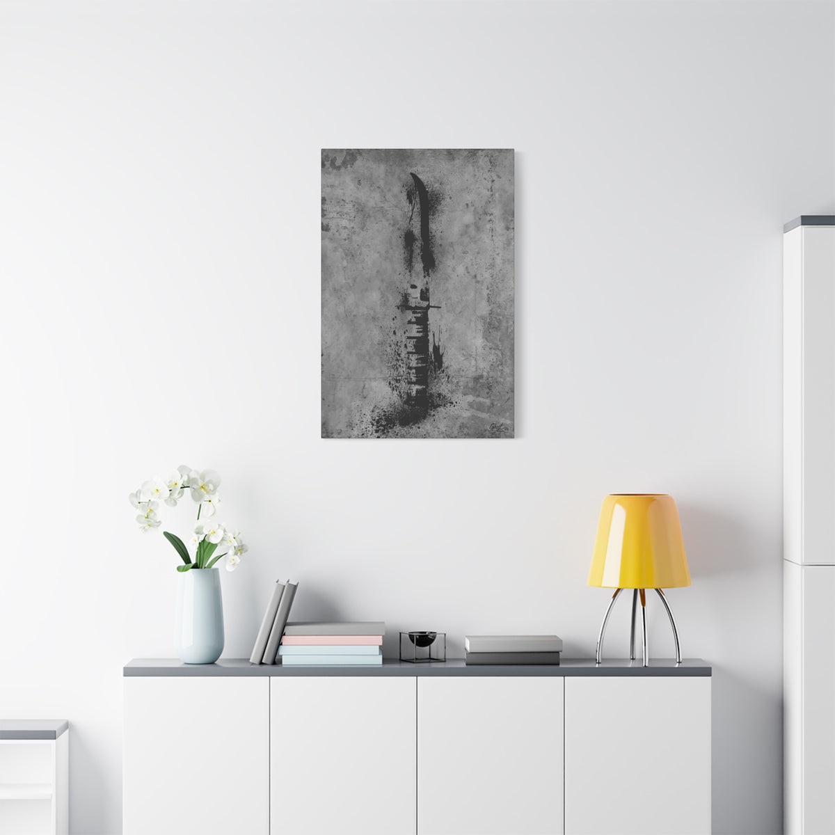 Marines BFF small canvas above a white sideboard and yellow lamp, Marine fighting knife in black ink spatter on concrete gray