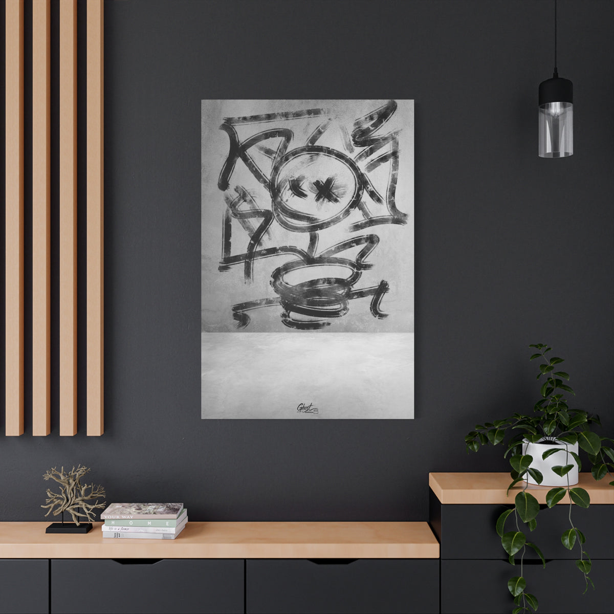 Going Crazy large canvas on a charcoal wall by wood slats, loose black marks circling a central form above a small cup shape