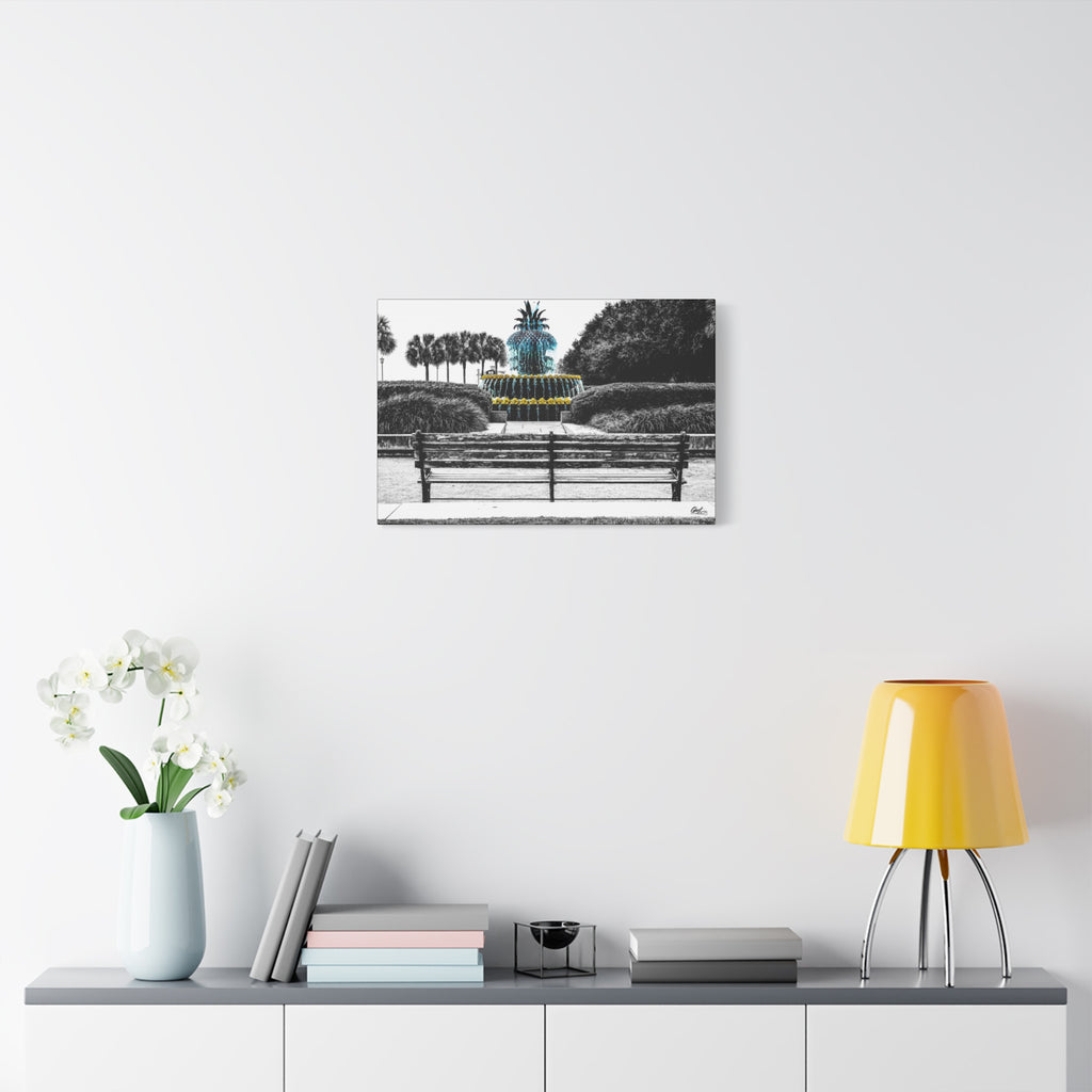 The Pineapple of Peace canvas over a console with white flowers, stylized pineapple fountain with palmettos and a park bench
