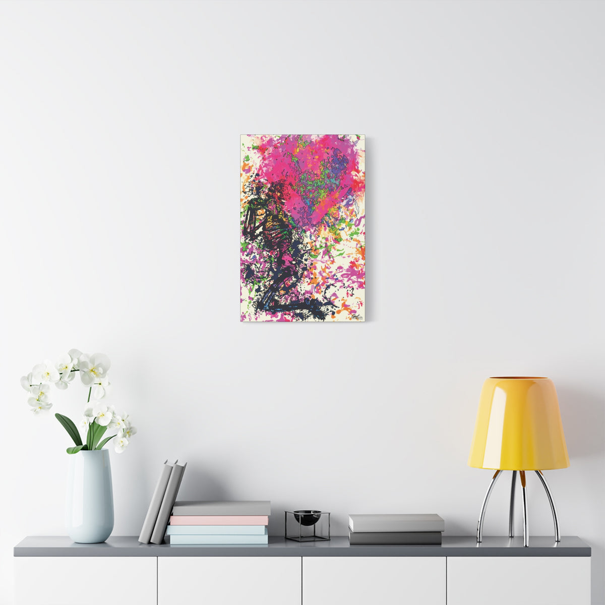 Waiting on My Love small canvas over a console with white flowers, kneeling skeletal figure under a fuchsia splatter heart
