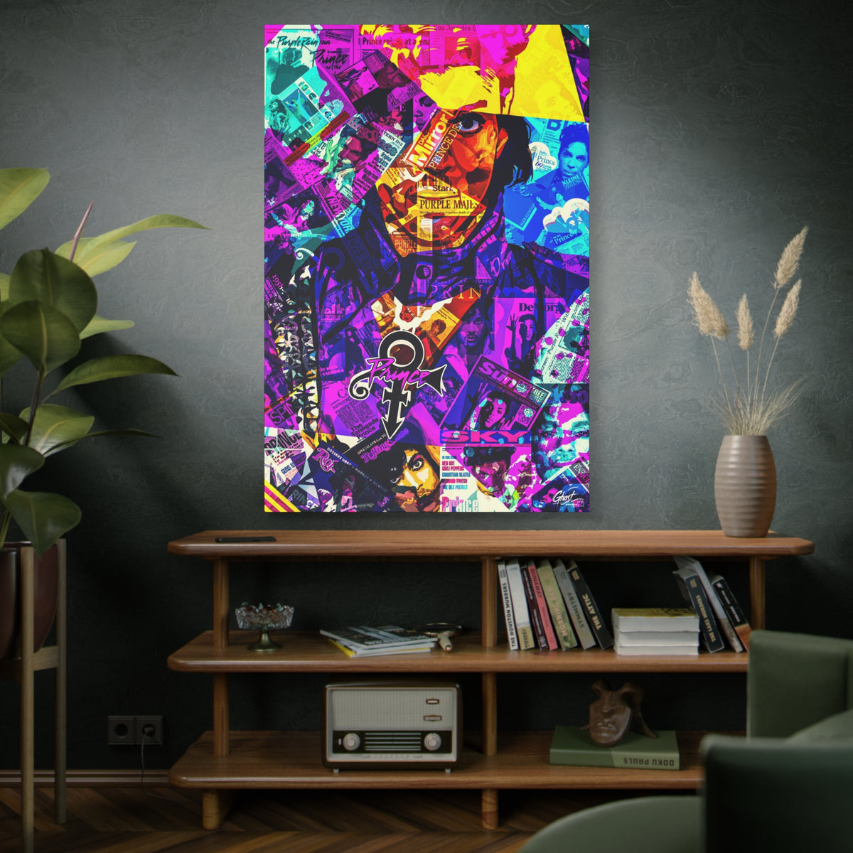 The Symbol oversized canvas above a wooden bookshelf, portrait in a yellow hat over a purple and teal magazine collage
