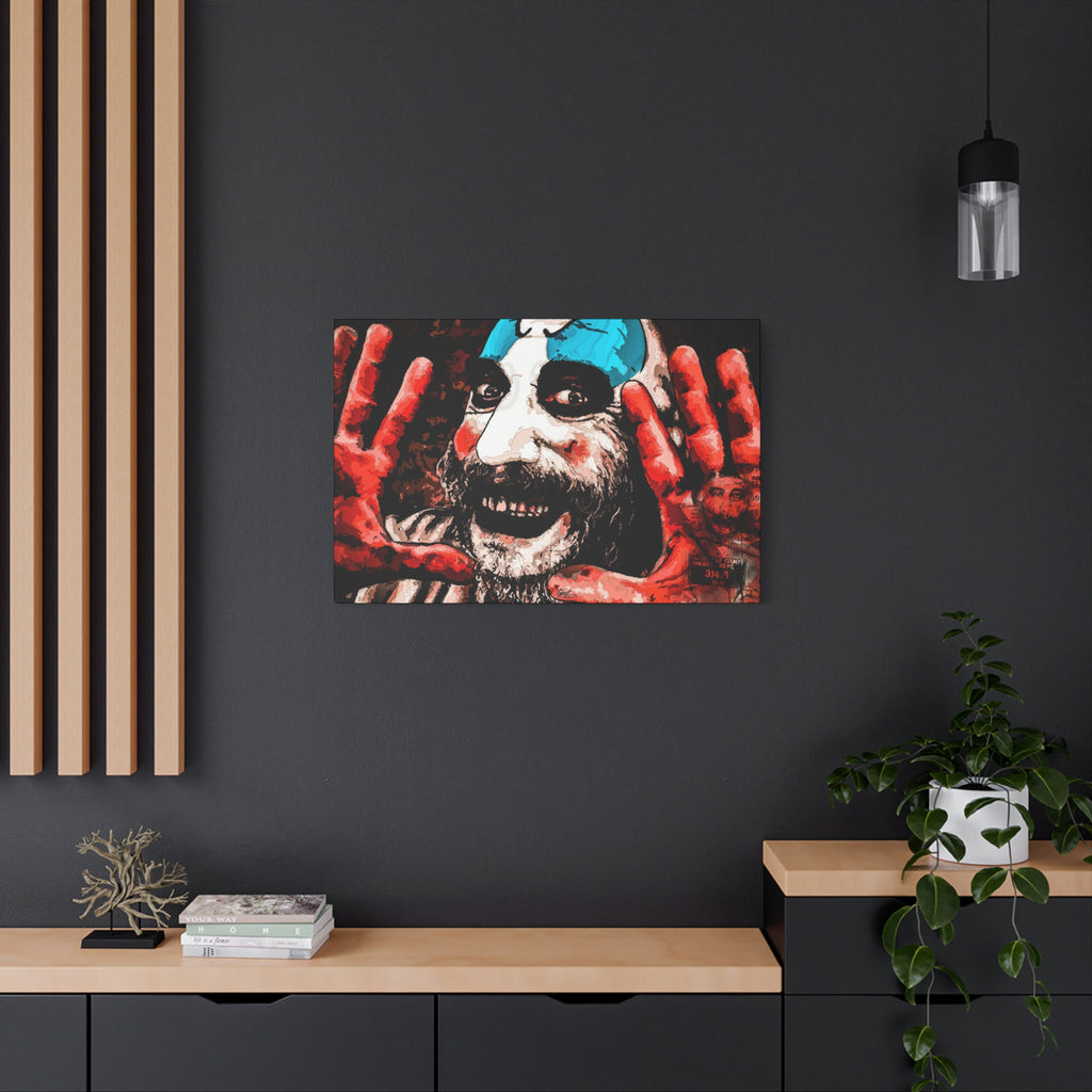Don't Turn Your Back canvas on a charcoal wall over an oak shelf, grinning clown with blue-and-white face paint and red hands