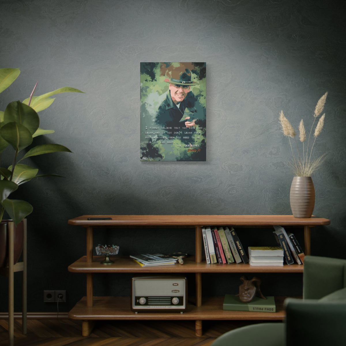 Live and Learn medium canvas on a green-gray wall over bookshelves, grinning drill instructor in olive and forest green
