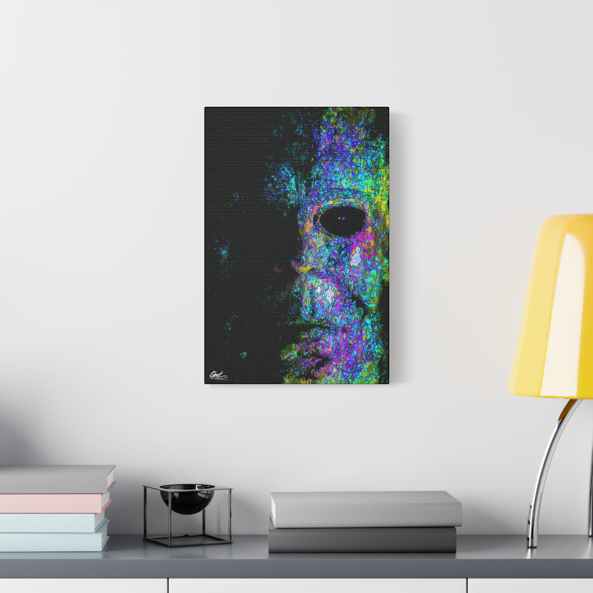 Stalk at Night, Neon Edition canvas beside a yellow desk lamp, pale mask sketched in fine lines with neon blue, violet and pink
