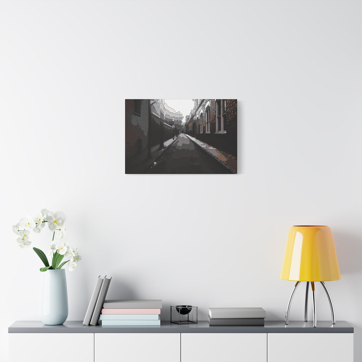 Charleston One Way medium canvas over a console with white flowers, moody alley with old brick walls and long shadows