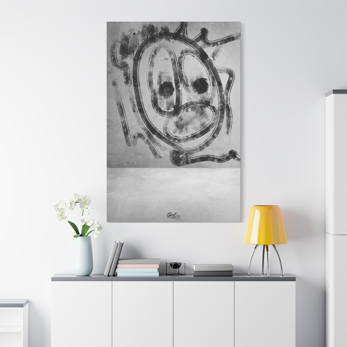 Thinking Out Loud oversized canvas on a white wall over a sideboard, black-and-white abstract face with blurred edges