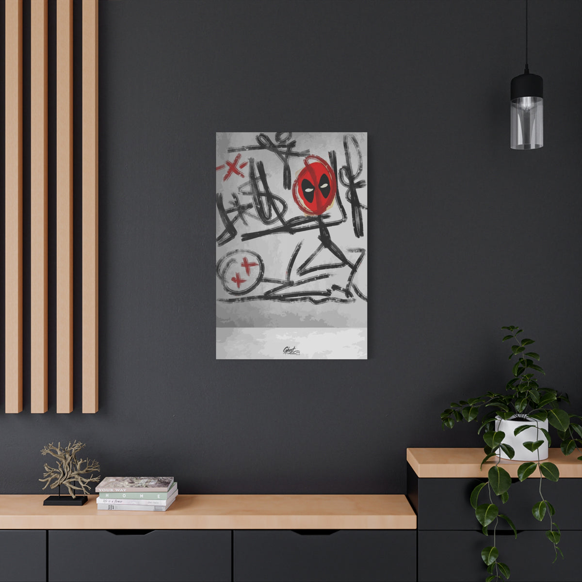 X'd Out canvas on a charcoal wall by wood slats, black brushstroke doodles with a red mask emblem