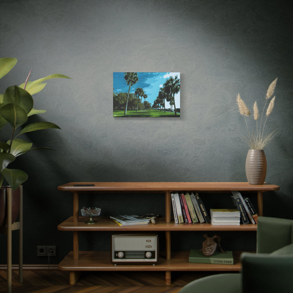The Battery (Original) small canvas on a green-gray wall over bookshelves, sunlit palms and long shadows by the water