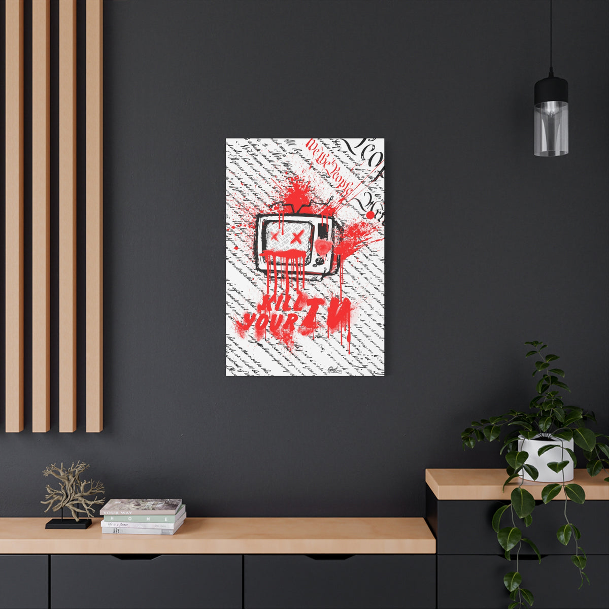 Kill Your TV large canvas on a charcoal wall over an oak shelf, hand-drawn TV with X eyes and bursting red paint