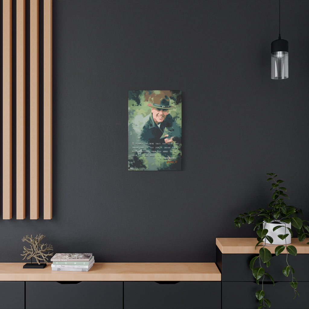 Live and Learn small canvas on a charcoal wall over an oak shelf, painterly drill instructor portrait in camo greens