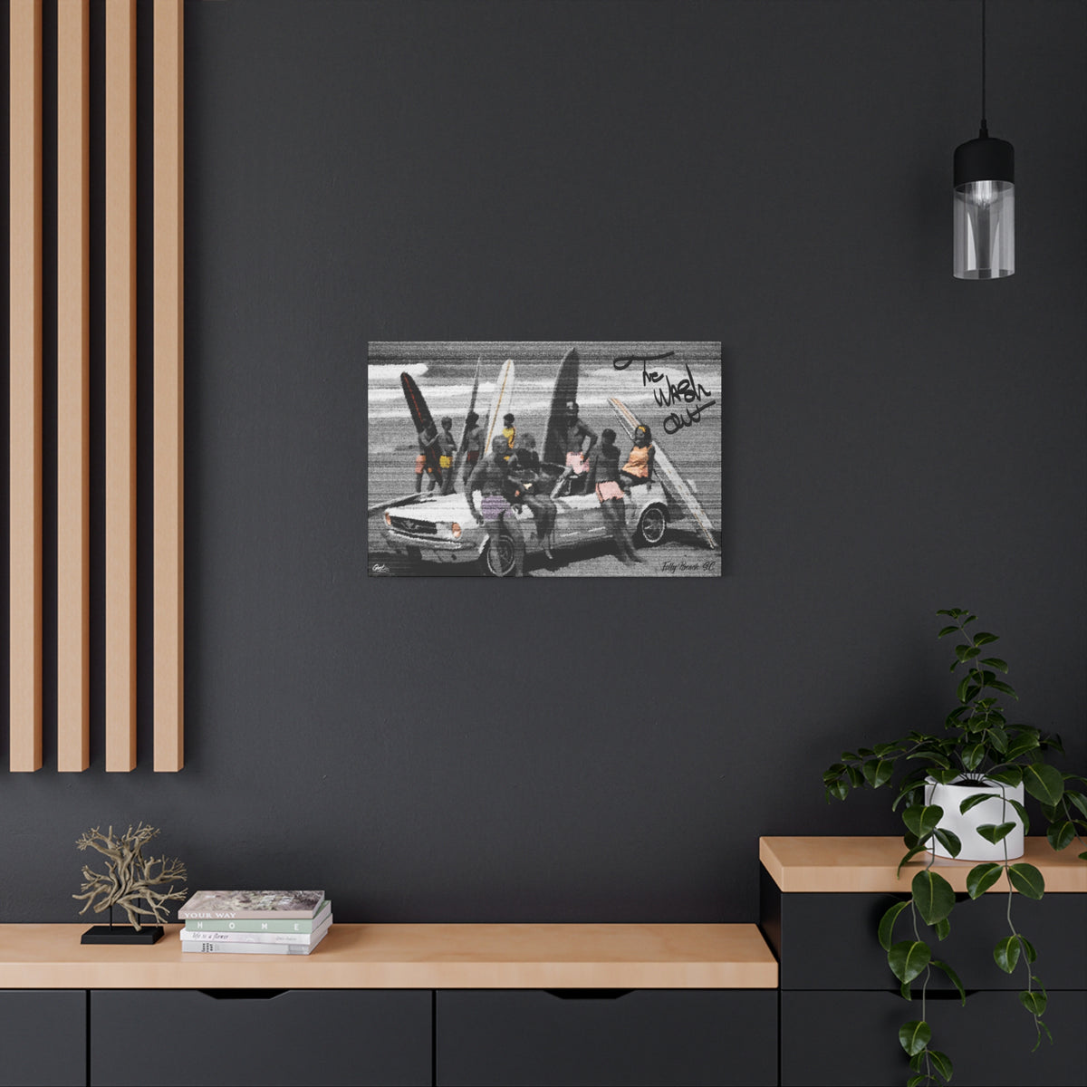 The Wash Out medium canvas on a charcoal wall over an oak shelf, grainy beach-day photo with a surfboard-loaded convertible