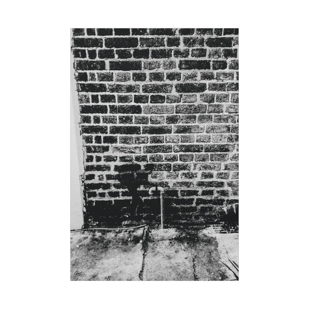 A Little Hiking in Charleston canvas print, front view: high-contrast brick wall with a tiny stencil hiker, Charleston SC
