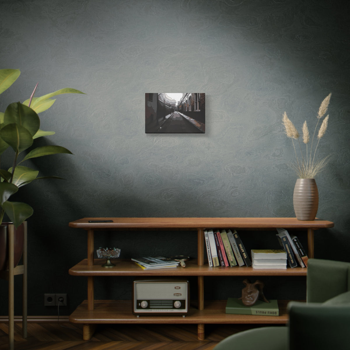 Charleston One Way small canvas on a green-gray wall over bookshelves, narrow one-way alley in dark, muted tones