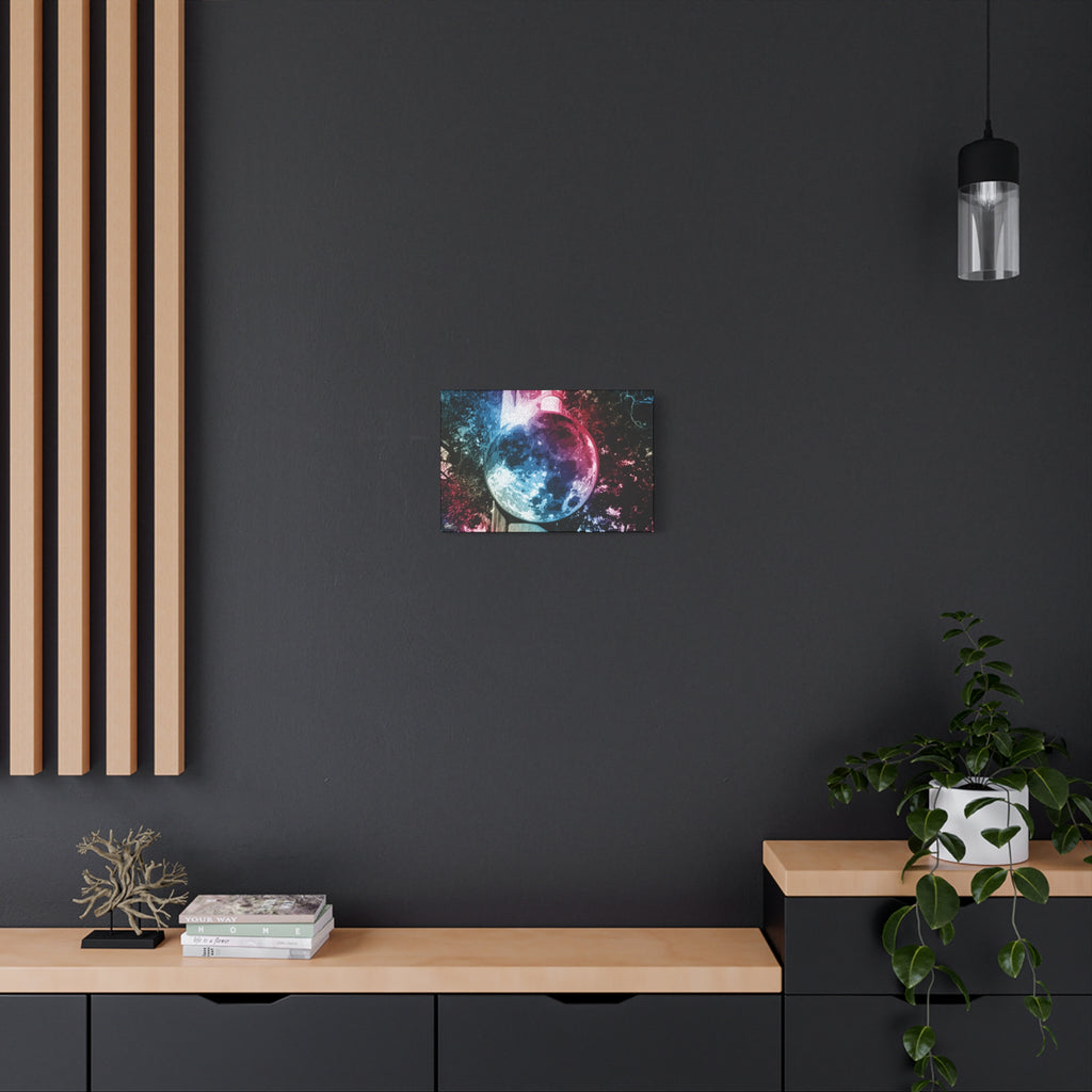 Universe in a Mirror small canvas on a charcoal wall over an oak shelf, pink and blue mirrored orb
