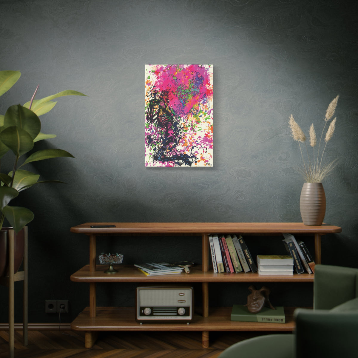 Waiting on My Love canvas on a green-gray wall over bookshelves, kneeling skeletal figure under a fuchsia splatter heart
