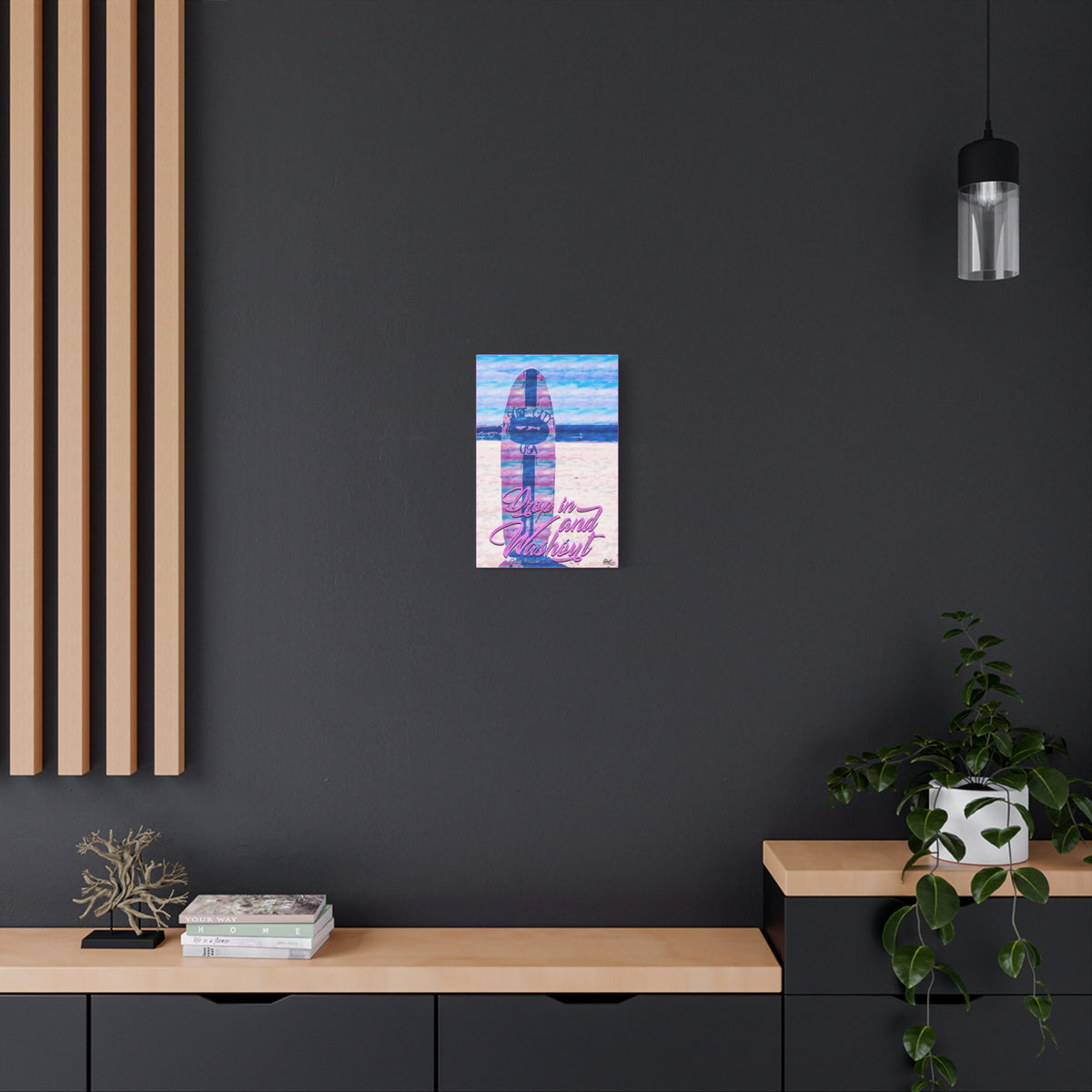 Drop In and Wash Out, Folly Beach canvas on a charcoal wall by wood slats, sun-bleached surfboard art in soft pinks and blues