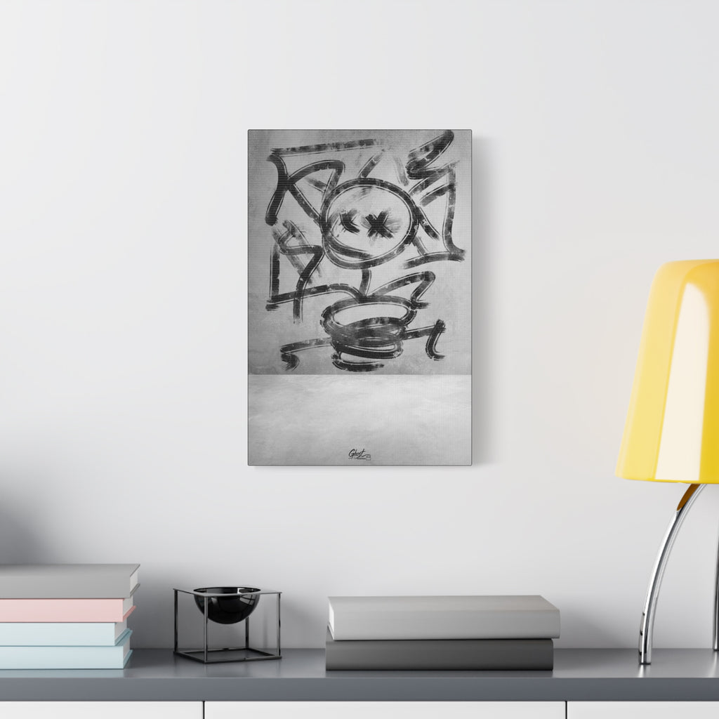Going Crazy small canvas beside a yellow desk lamp, loose black marks circling a central form above a small cup shape