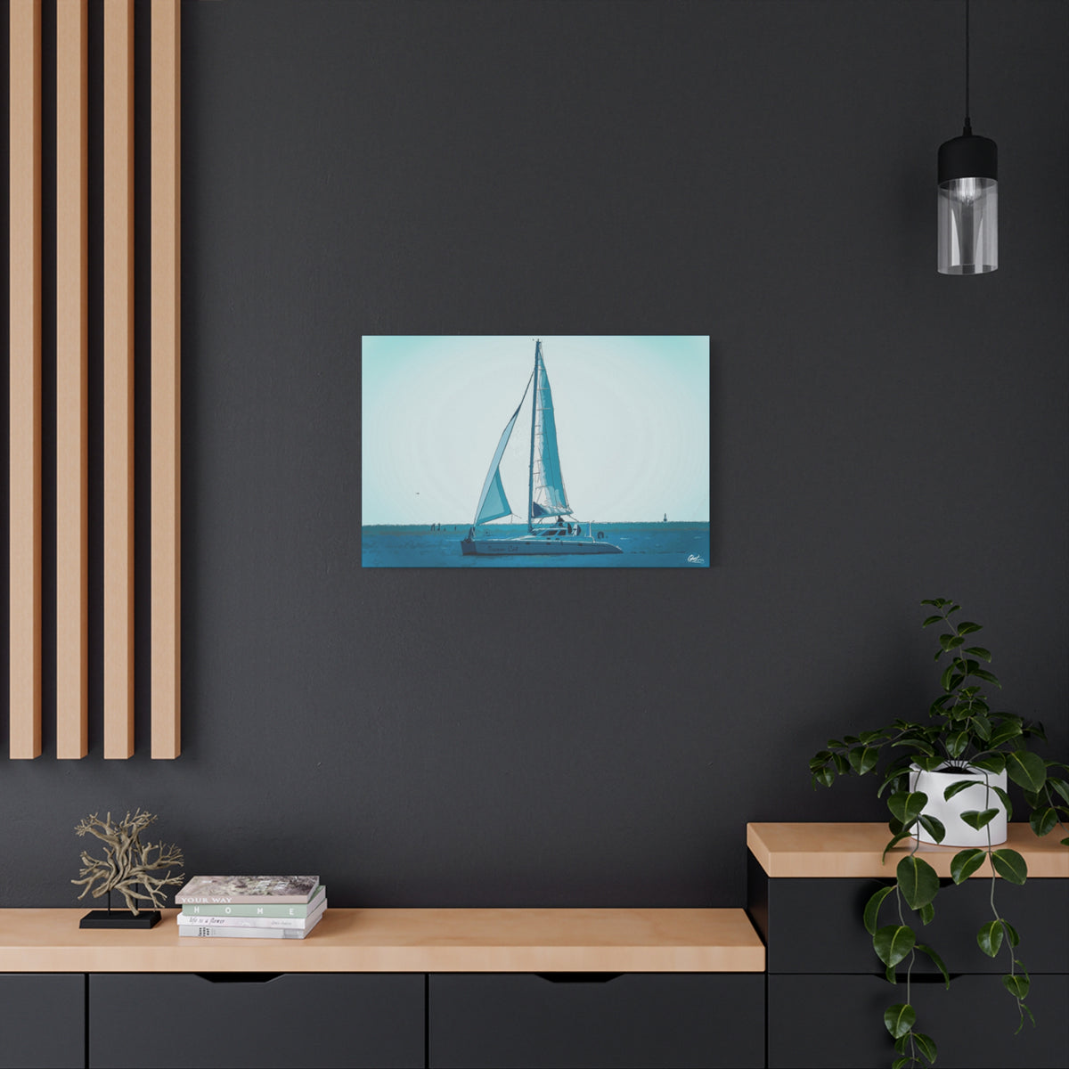 Freedom Sailing medium canvas on a charcoal wall over an oak shelf, lone sailboat on soft aqua and teal water