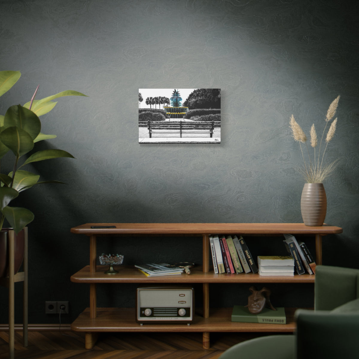 The Pineapple of Peace medium canvas above a wooden bookshelf, Southern hospitality pineapple in soft grays and greens
