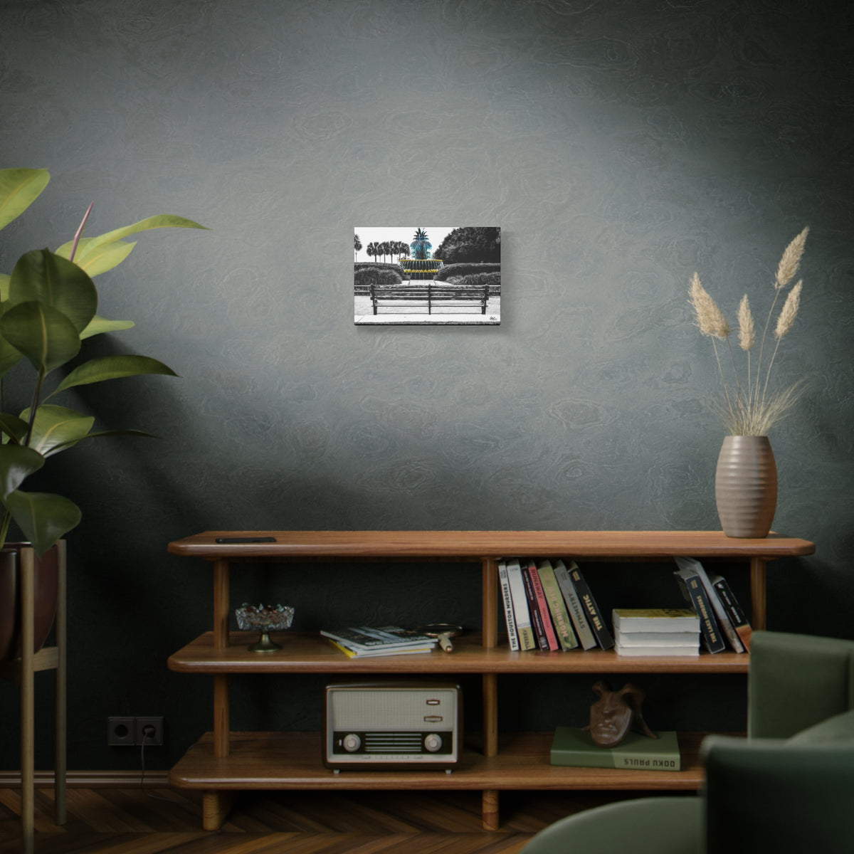 The Pineapple of Peace canvas on a green-gray wall over bookshelves, Southern hospitality pineapple in soft grays and greens