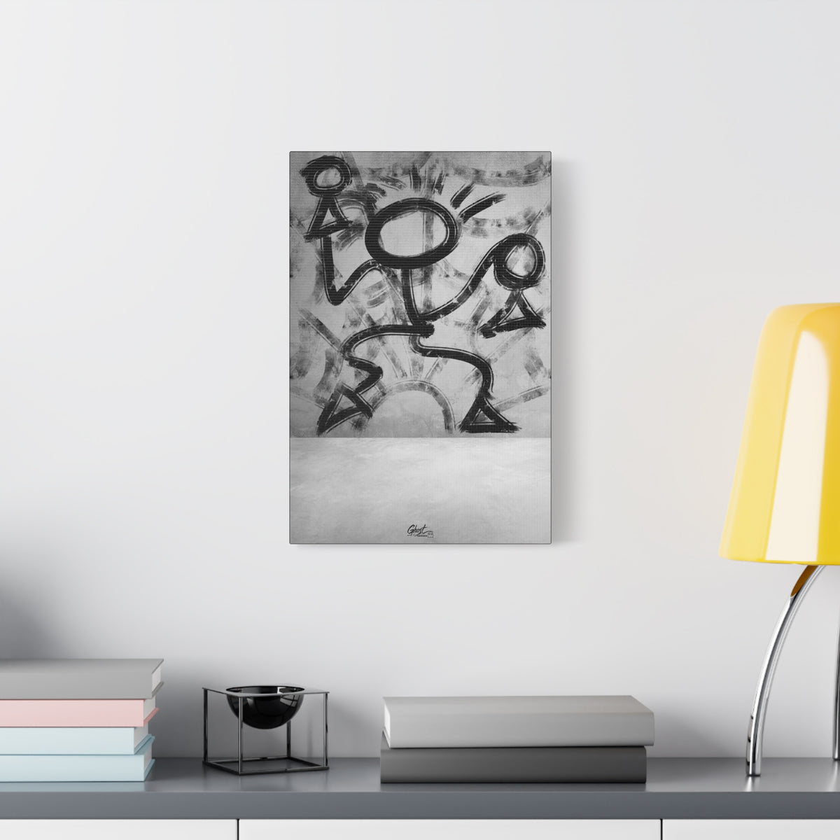 Trapped small canvas beside a yellow desk lamp, black-and-white brushstroke figure pressing against invisible walls