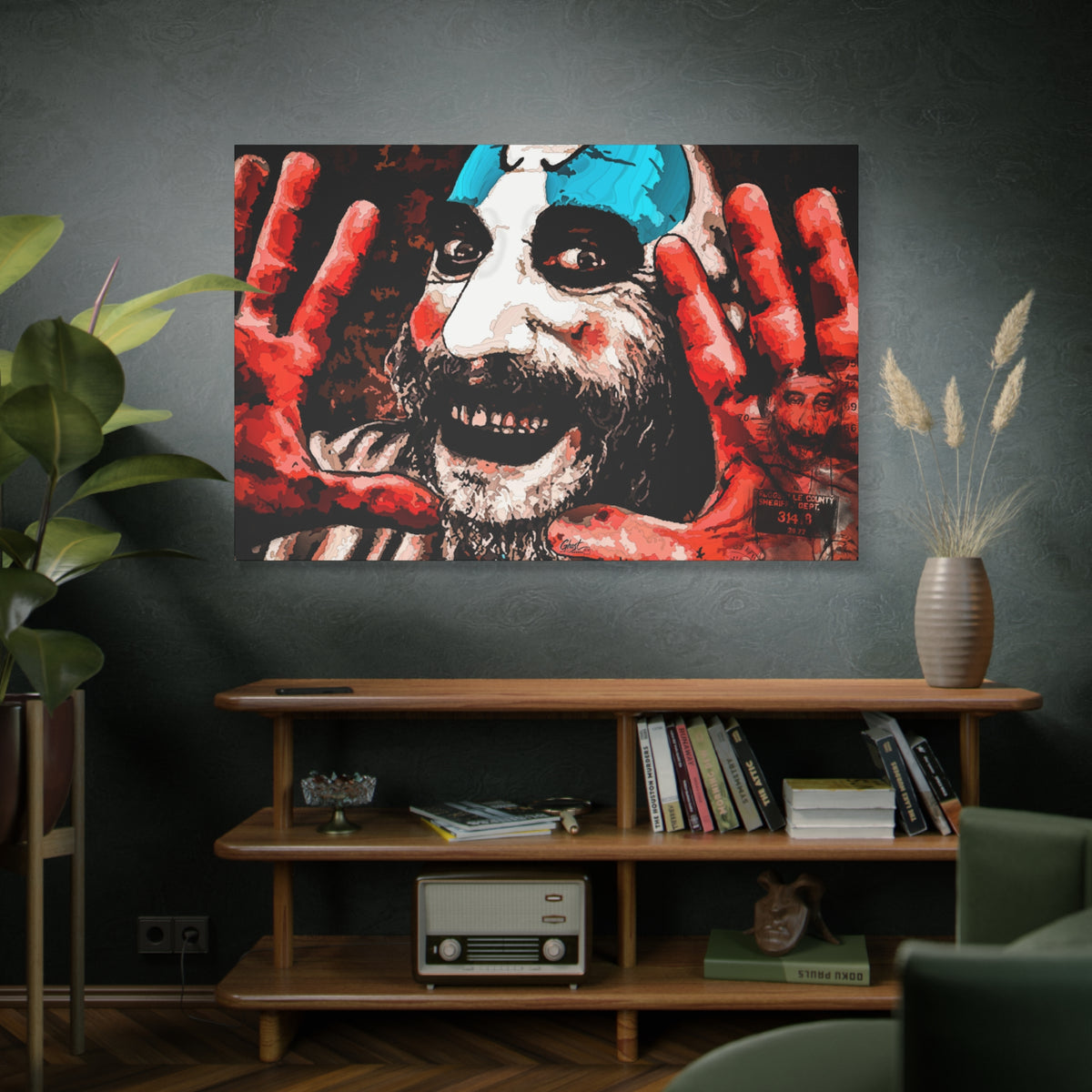 Don't Turn Your Back oversized canvas above a wooden bookshelf, grinning clown with blue-and-white face paint and red hands