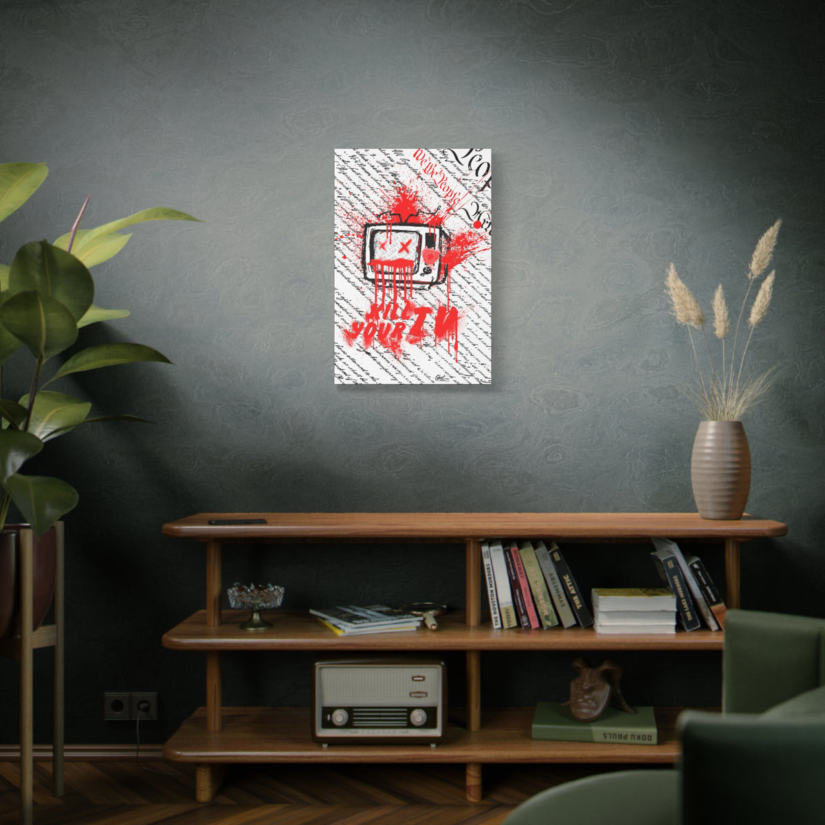 Kill Your TV medium canvas on a green-gray wall over bookshelves, hand-drawn TV with X eyes and bursting red paint