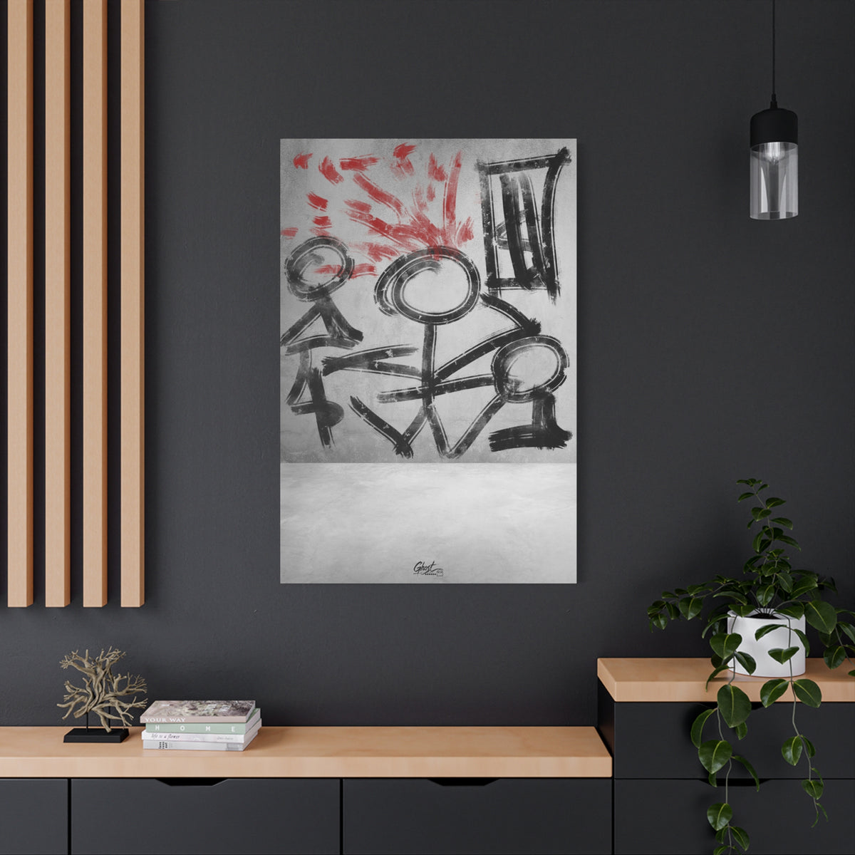 Stressed Out large canvas on a charcoal wall by wood slats, black stick figures beneath red brushstroke rays