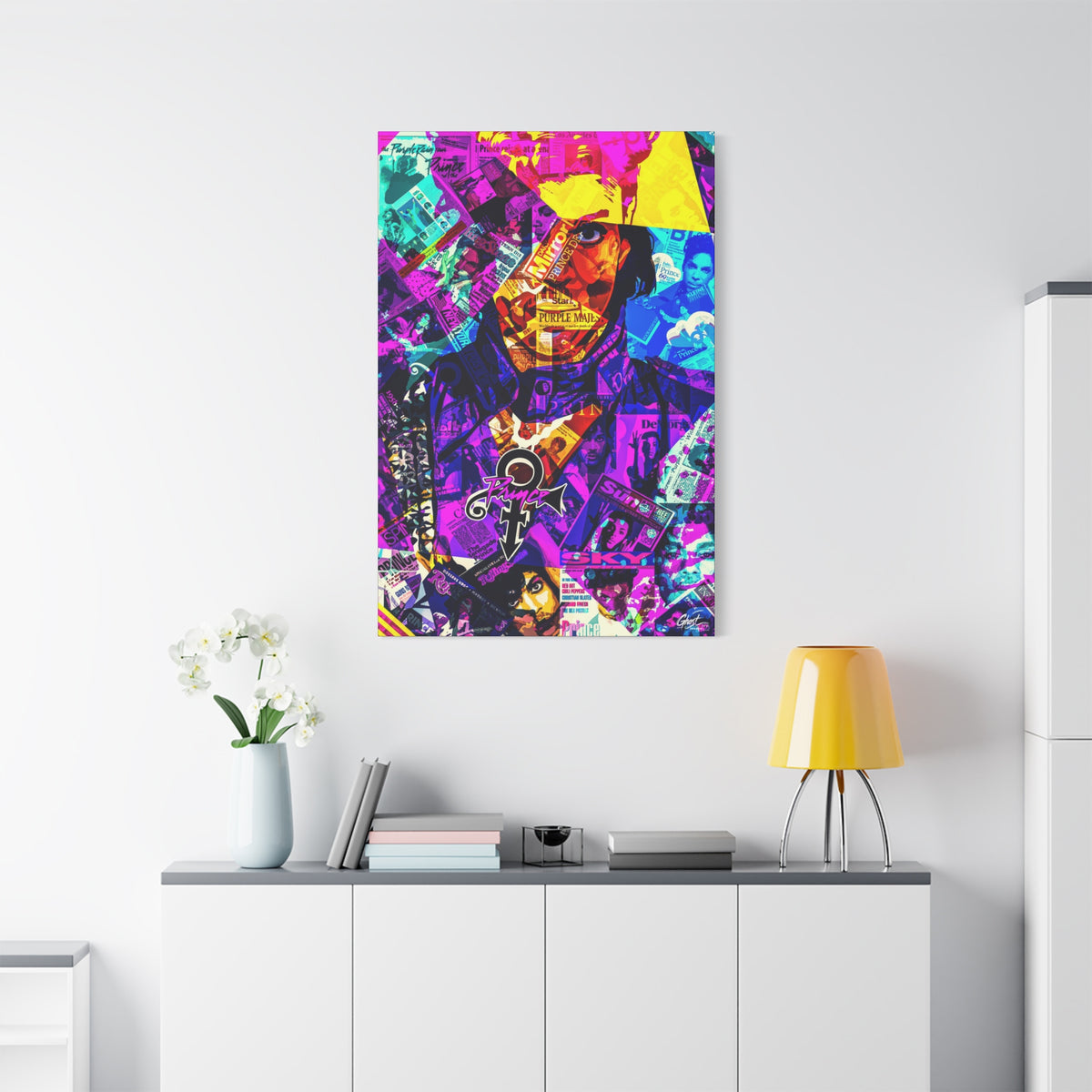 The Symbol medium canvas on a white wall over a sideboard, vibrant collage portrait in magenta and gold