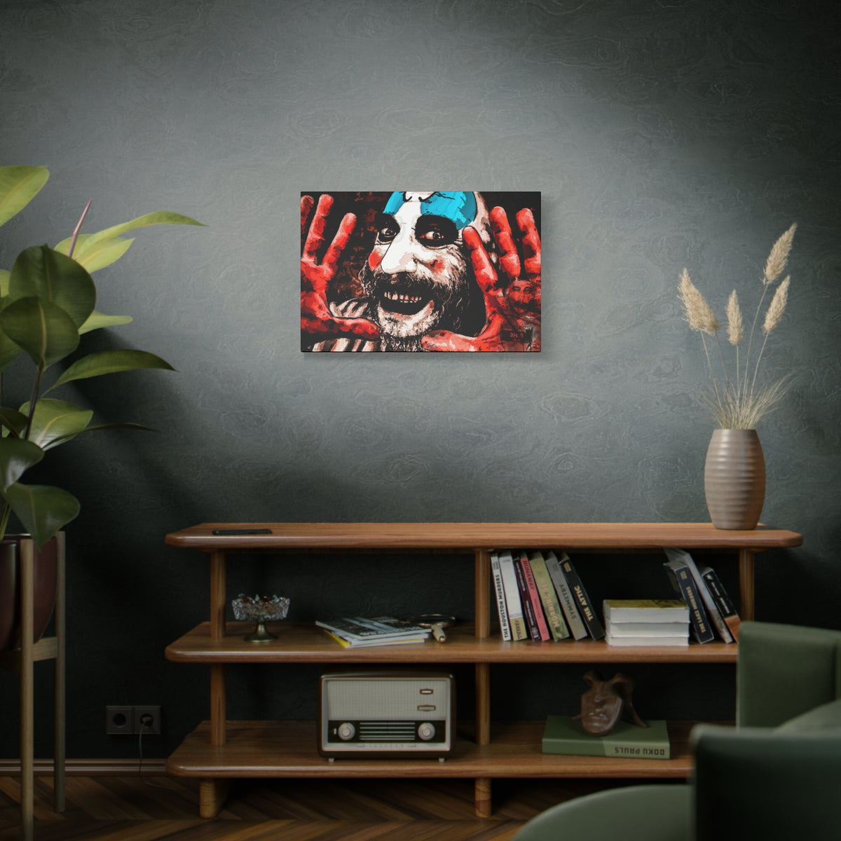 Don't Turn Your Back medium canvas on a green-gray wall over bookshelves, high-contrast red and white clown portrait