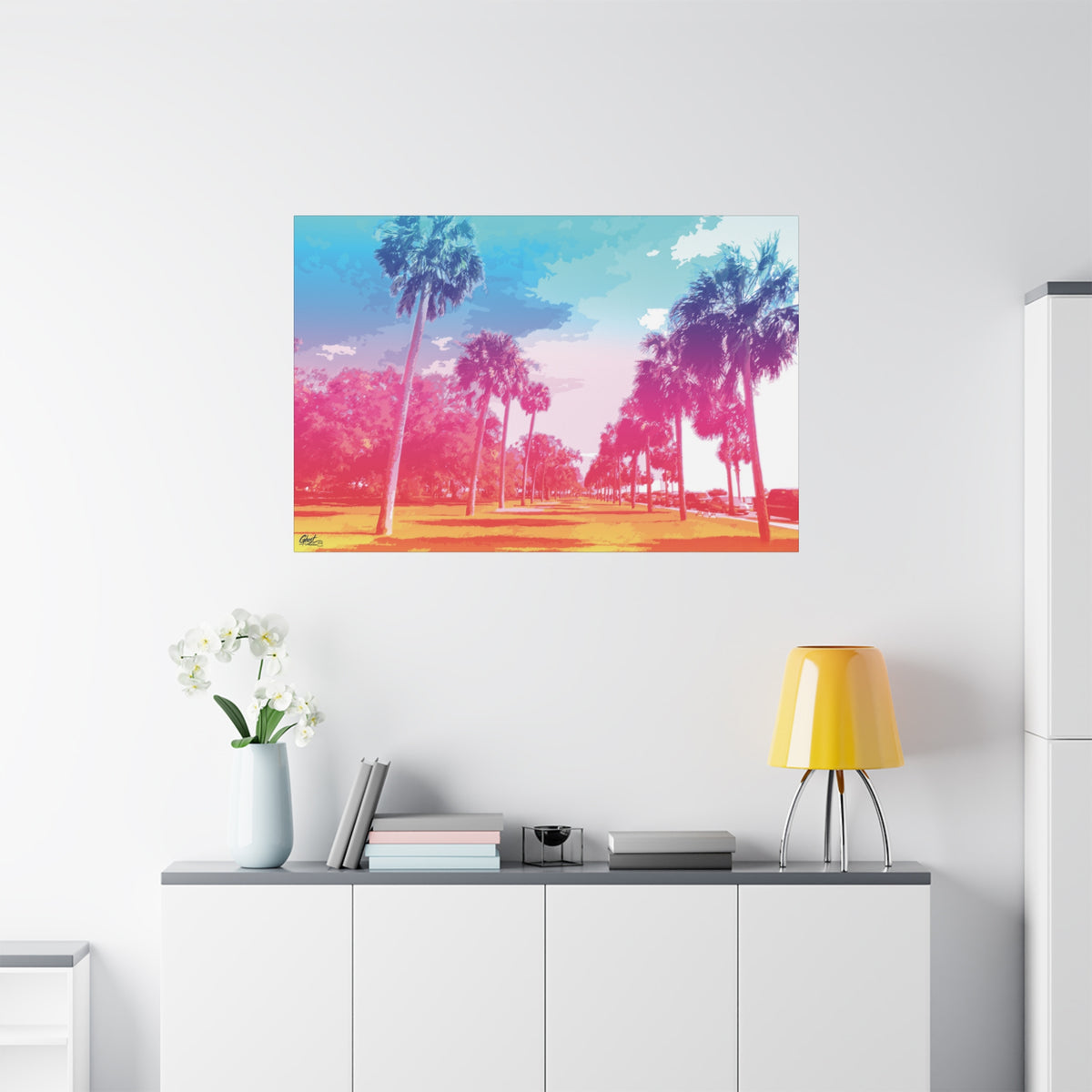 The Battery Tropical Edition large canvas on a white wall over a sideboard, palms in a pink and turquoise sunset