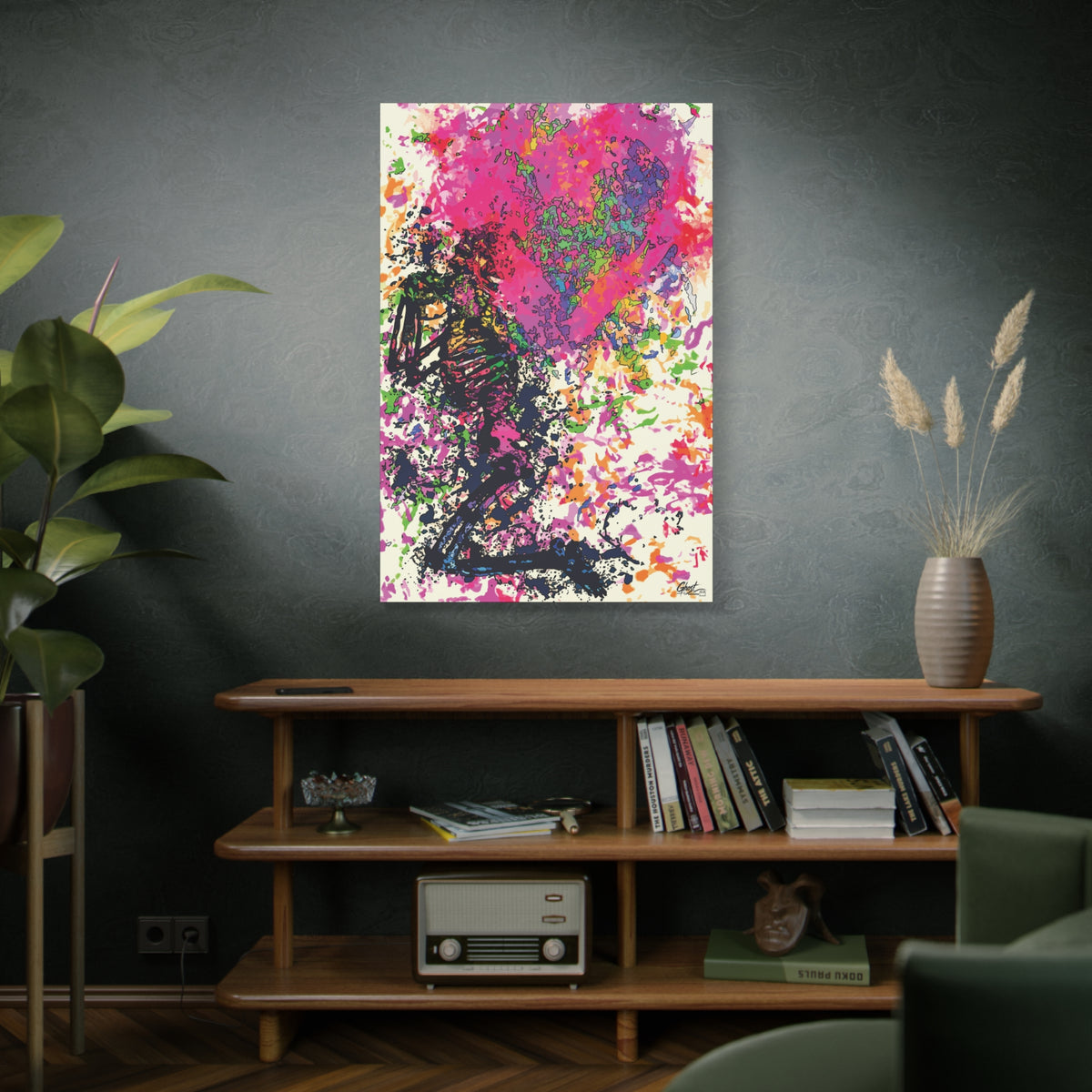 Waiting on My Love large canvas above a wooden bookshelf, kneeling skeletal figure under a fuchsia splatter heart