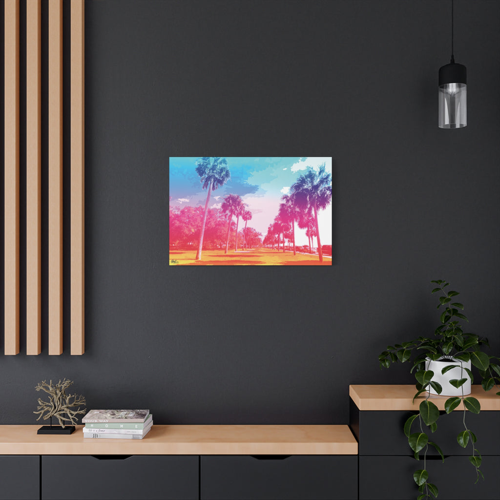 The Battery Tropical Edition medium canvas on a charcoal wall over an oak shelf, palms in a pink and turquoise sunset