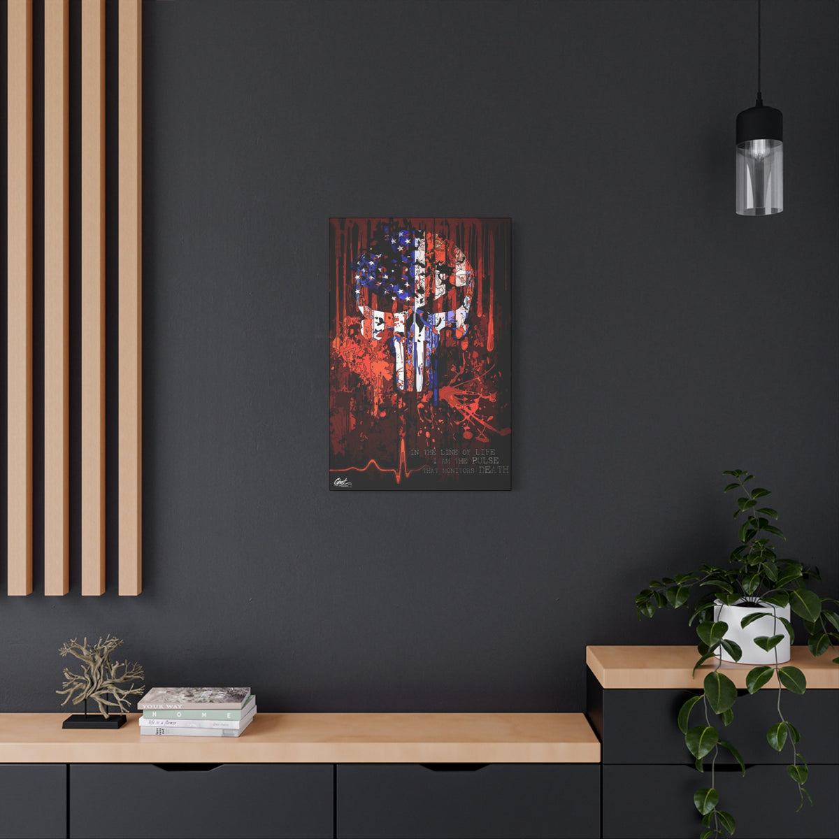 The Vigilante small canvas on a charcoal wall by wood slats, red, white and blue flag skull on black