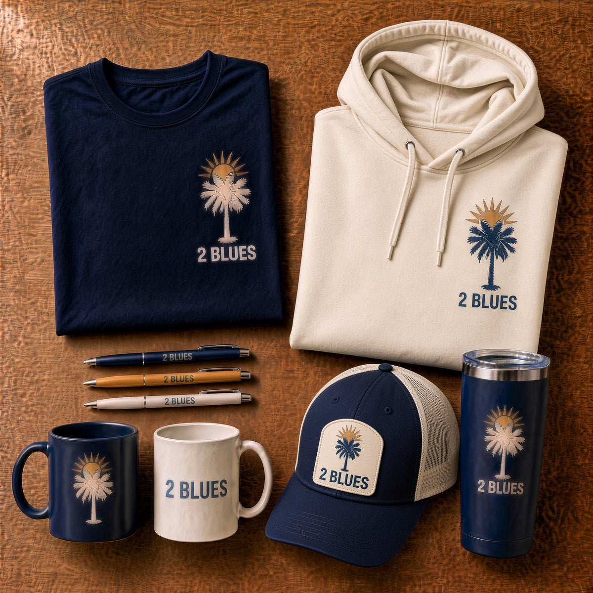 Custom Apparel: navy tee, cream hoodie, caps and mugs printed with a palm tree logo