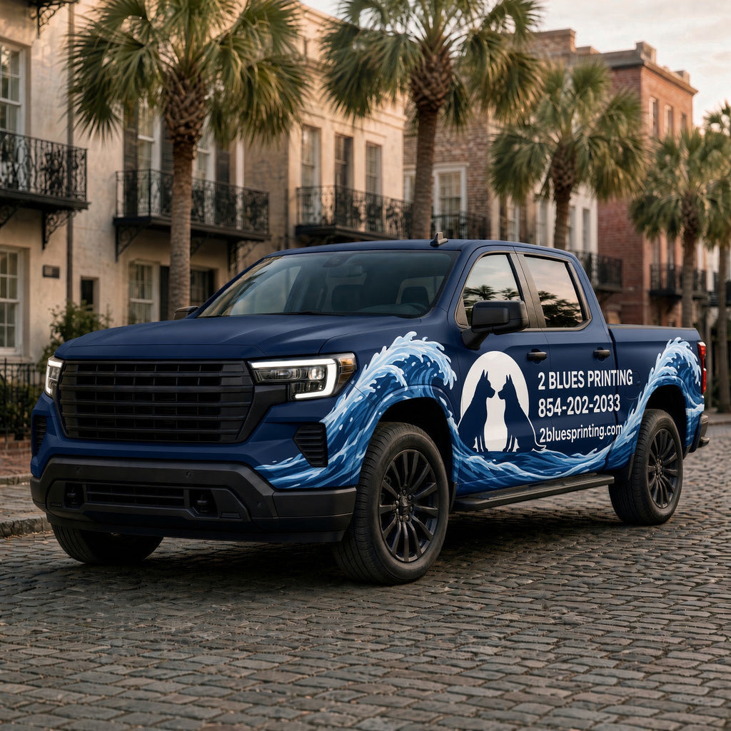 Custom Vehicle Wrap: navy pickup truck with a blue and white logo wrap on a palm-lined street