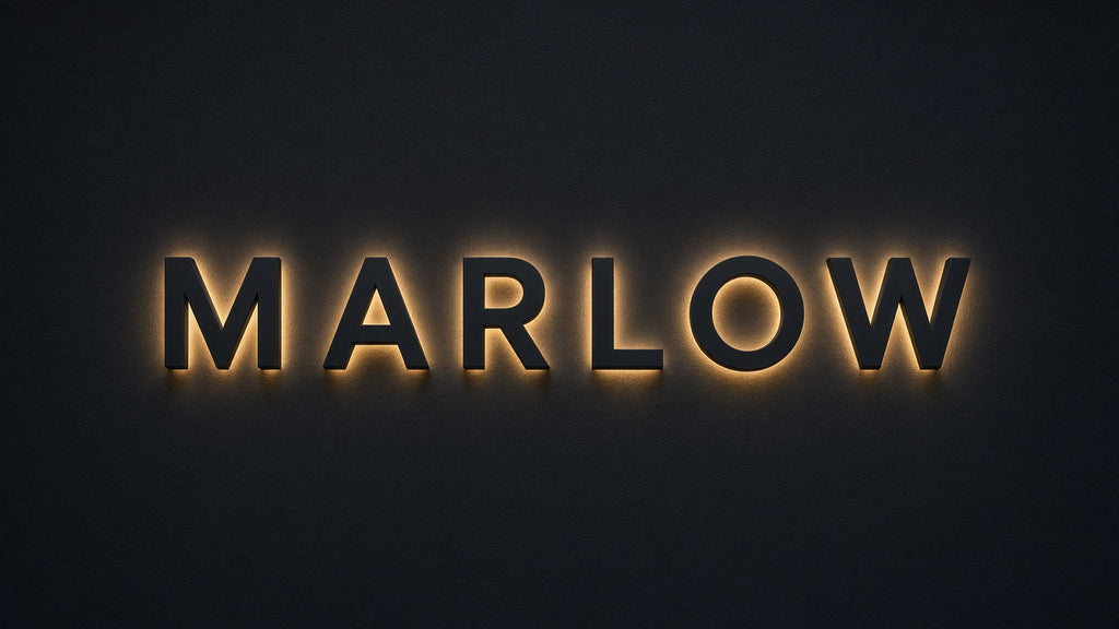 Custom Signs: backlit MARLOW halo-lit lettering on a black wall